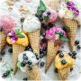 ice cream cone with different flavors, decorated with blueberries
